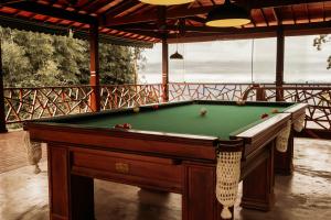 a pool table sitting in a room with at Turisfri Resort in Nova Friburgo