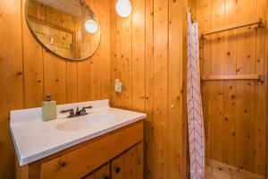 a bathroom with a sink and a mirror at Rustic Cabin W Games Near Lake & National Park in Tobermory +37 photos