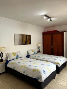 Ένα ή περισσότερα κρεβάτια σε δωμάτιο στο Casa Colonia