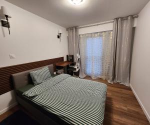 a bedroom with a bed and a window at Appartement Basilique 4 chambres tout confort Saint Denis in Saint-Denis +16 photos