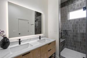 a bathroom with a sink and a mirror and a shower at Mid-century Modern Escape Hikingbiking Nearby! in Salida +33 photos