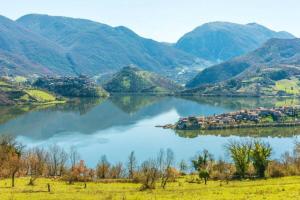 a view of a lake with mountains in the background at B&B Santa Vittoria in Monteleone Sabino