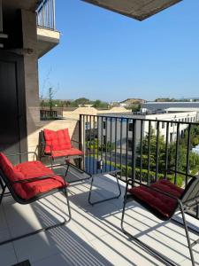 two chairs on a balcony with a view at Apartment for daily rent in Tbilisi City +9 photos