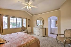 a bedroom with a bed and a dresser and a ceiling fan at El Paso Retreat with Pool 11 Mi to Downtown! in El Paso +20 photos