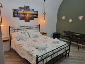 a bedroom with a bed with two towels on it at Il borgo in Vico Equense
