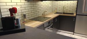 a kitchen with a sink and a counter top at Αλέξανδρος 6 in Mirina +9 photos