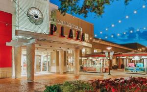 a shopping mall with a sign that reads pdq at Luxury apartments in Tampa