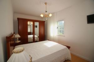 En eller flere senge i et værelse på Casa da Idalina + 21 billeder