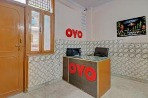 a xoxo counter in a room with a door at Hotel O by OYO Happy Homes in New Delhi