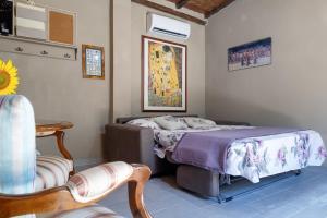 Ένα ή περισσότερα κρεβάτια σε δωμάτιο στο Il Nido in Toscana casa vacanze