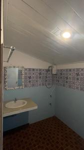 a bathroom with a sink and a mirror at Sunset Dream Beach Front House in Thong Sala +25 photos