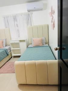 a room with a couch and a bed in it at Luxurious and comfortable 1 level in Juan López