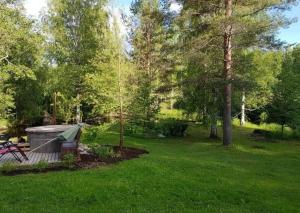 a backyard with a gazebo in the grass at Chez-Nous Äänekoski in Äänekoski +62 photos