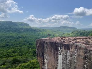 a person standing on the edge of a cliff at Joes Homestay in Siem Reap