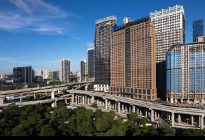 a view of a city with a bridge and buildings at Mossaz minimalist studio 3 in Petaling Jaya