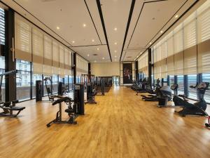 a gym with treadmills and exercise equipment in a building at Mossaz minimalist studio 3 in Petaling Jaya