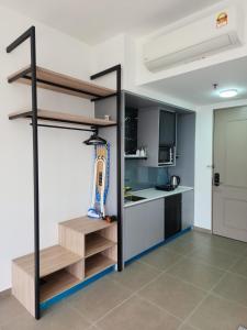a kitchen with a staircase in a room at Mossaz minimalist studio 3 in Petaling Jaya