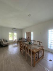 a living room with a table and a couch at Secret Peak Villas in Huu