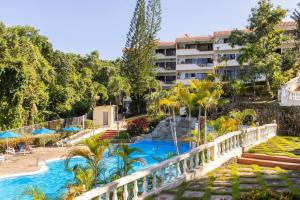 a view of a resort with a swimming pool at nNomad Studio mins from Sirena - Apartment in Sosua
