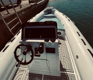 a boat with a steering wheel in the water at Wave Dancer in Hurghada