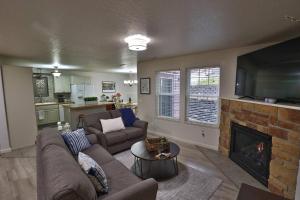 a living room with a couch and a fireplace at Peaceful Retreat In The Heart Of Missoula in Missoula