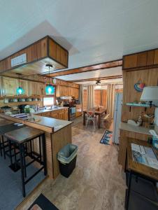 a large kitchen with wooden cabinets and a table at Port Clinton Lakeside Escape in Port Clinton