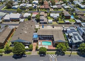 an aerial view of a city with a house at Coasters 27 in Sawtell +4 photos