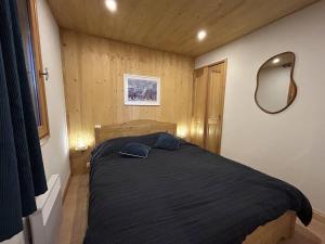 En eller flere senge i et værelse på Appartement confortable 4/6 pers. à Méribel, proche pistes - FR-1-355-275