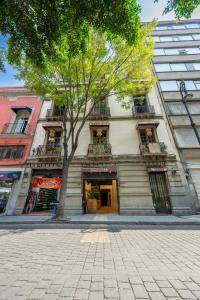 a building with a tree in front of it at DH3 VIP & Luxurious 2beds APT in Historic Center in Mexico City