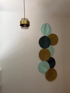a wall with a bunch of different colored circles at Hotel Tierra Dorada in Guayaquil