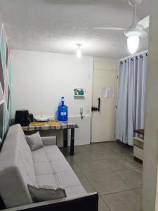 a living room with a couch and a table at Aconchegante apto na Z Oeste in Sao Paulo