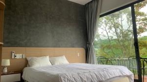 Ένα ή περισσότερα κρεβάτια σε δωμάτιο στο An Nhien Serenity +56 φωτογραφίες