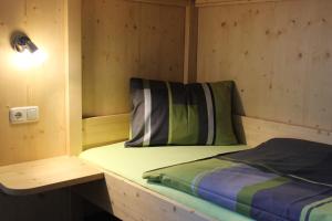 A bed or beds in a room at Appartement Höll