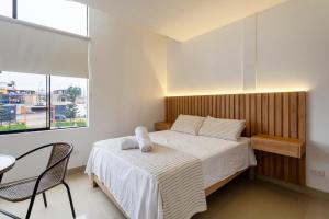 Ένα ή περισσότερα κρεβάτια σε δωμάτιο στο Huaral House +20 φωτογραφίες
