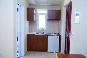 Kuchyň nebo kuchyňský kout v ubytování Summertime Inn