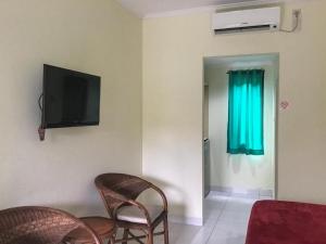 Μια τηλεόραση ή/και κέντρο ψυχαγωγίας στο Pondok Mesari Padma Legian RedPartner +16 φωτογραφίες