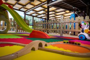 a childs play area with a slide in a playground at Metaxatos Apartments in Lassi