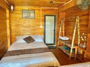 Postel nebo postele na pokoji v ubytování Man Di HomeStay Lô Lô Chải