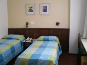 Cama ou camas em um quarto em Hotel São Bento