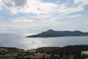 a view of a large body of water with a mountain at Bonatsa House in Agios Georgios