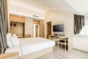 TV a/nebo společenská místnost v ubytování ZMAX Hotels Wuhan East Lake