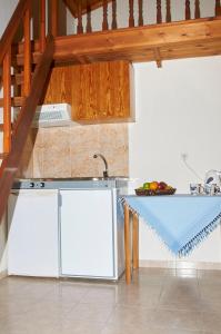 a kitchen with a sink and a counter top at Kamares Studios in Symi