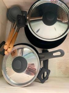 a pot and pans sitting on top of a table at Palm Light Nusa Dua in Nusa Dua