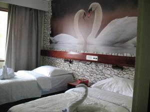 Postel nebo postele na pokoji v ubytování Hotel Kemijärvi