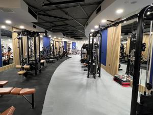 a gym with many rows of tread machines at 4Seasons Ciprus 1+1 in Boğaz