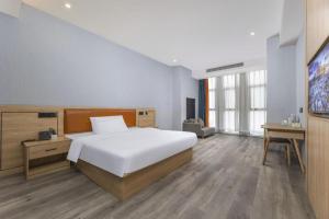 Postel nebo postele na pokoji v ubytování Borrman Hotel Jiangyin Zhouzhuang + 210 fotografií