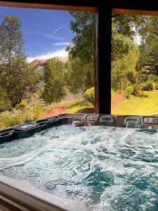 a hot tub with a view of a mountain at Luxe Mountain Village Retreat Hot Tub with Views in Telluride