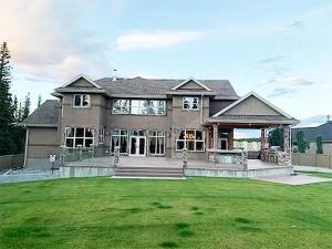 a large house with a large lawn in front of it at A Gorgeous Mansion for Jasper Vacation in Hinton
