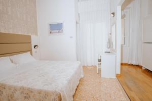 Postel nebo postele na pokoji v ubytování Hotel Gabriella