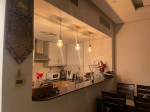 a kitchen with a counter and a counter top at Bahrain Amwaj in Amwaj Island